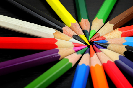 Colored pencils from stationery arranged in a circle. Rainbow Spectrum of writing needs for painting.の写真素材