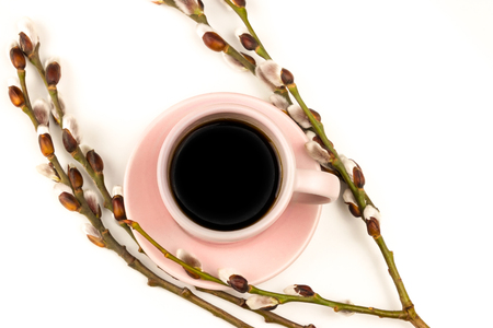 Spring coffe wallpaper with decoration. Hot drink on the white background. Pink coffe cup with flowers and hearts.の写真素材