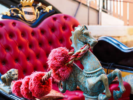 Canal with gondolas in Venice, Italy. Architecture and landmarks of Venice. Venice postcard with Venice gondolas. Detail of a gondola in Venice, Italy.の写真素材
