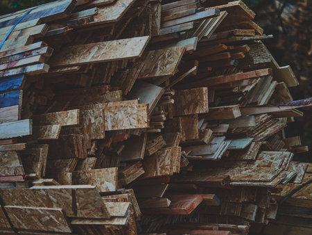 Warm matte composition of bundled wooden slats tied together, showcasing natural wood grain and craftsmanship texture. Perfect for eco materials, woodworking, sustainability, and construction concepts.の写真素材