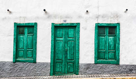 Green door and window of an old house in Spain, Gran Canariaの写真素材