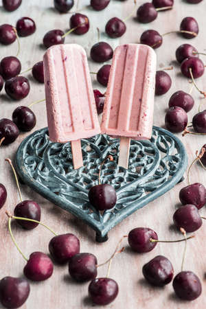 Cherry ice cream in a vintage heart shape support