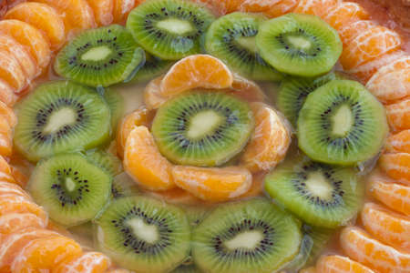 Mandarin and kiwi tart close upの写真素材