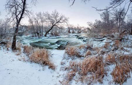 Beautiful winter sunset at the river Krinka. Forest in Ukraineの写真素材