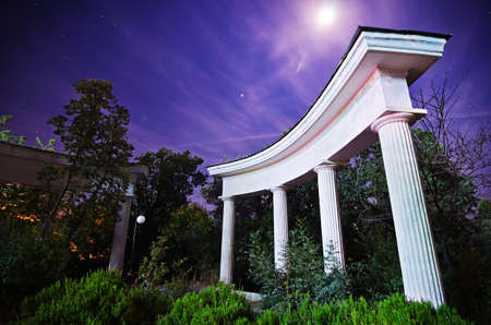 Night in the park. Trees behind the columns. Crimeaの写真素材