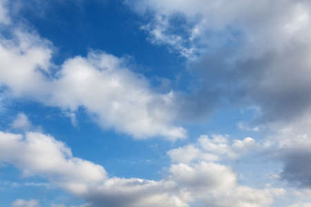 blue sky background with white clouds at sunsetの写真素材