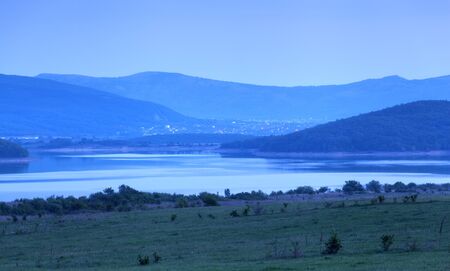 Beautiful landscape. Sunset in the mountains in summer. Lake in Crimea. Twilightの写真素材