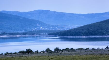 Beautiful landscape. Sunset in the mountains in summer. Lake. Twilight in Crimeaの写真素材