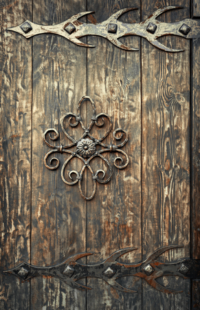 old rusty decorative element and wood door. Background for designの写真素材