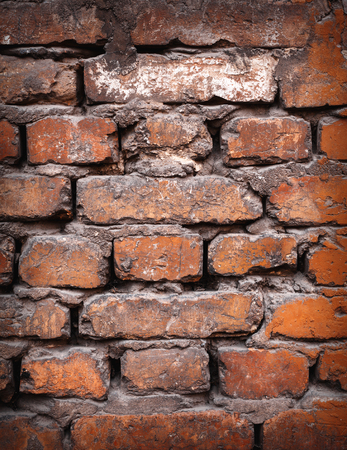 Background of colorful brick wall texture. brickwork. Peeling paint. Pattern of rustic grunge material.の写真素材