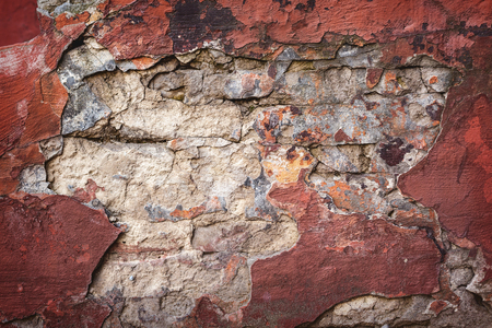 Background of colorful brick wall texture. brickwork. Peeling paint. Pattern of rustic grunge material.の写真素材