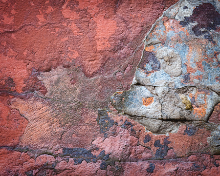 Background of colorful brick wall texture. brickwork. Peeling paint. Pattern of rustic grunge material.の写真素材
