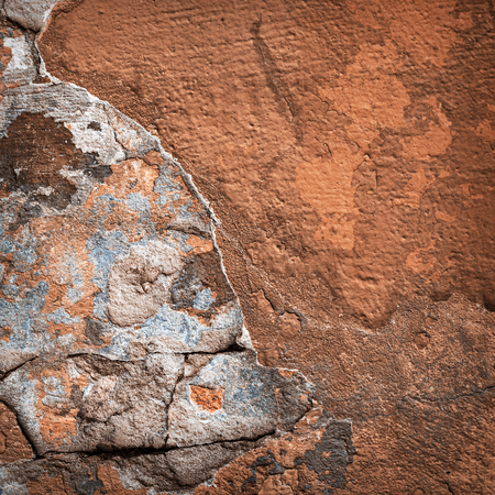 Background of colorful brick wall texture. brickwork. Peeling paint. Pattern of rustic grunge material.の写真素材
