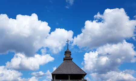 Old wood rustic church building and wooden fence against blue sky at sunsetの写真素材