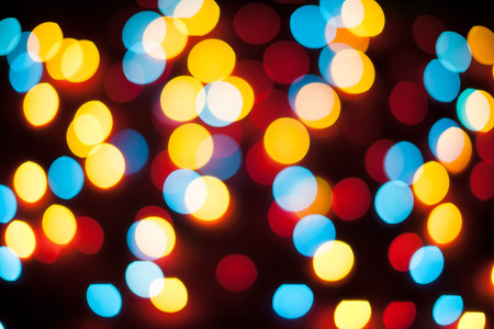 Defocused christmas lights. New Year bokeh. Abstract background for holiday designの写真素材