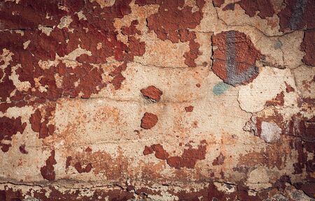 Background of old colorful peeling paint wall. Pattern of rustic grunge material.Texture