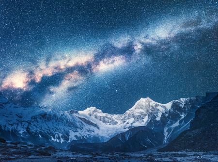 Milky Way and Beautiful Manaslu, Himalayas. Amazing view with himalayan mountains and starry sky at night in Nepal. High rocks with snowy peak and sky with stars. Night landscape with bright milky wayの写真素材