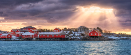 Norwegian fishing village and sea coast at sunsetの写真素材