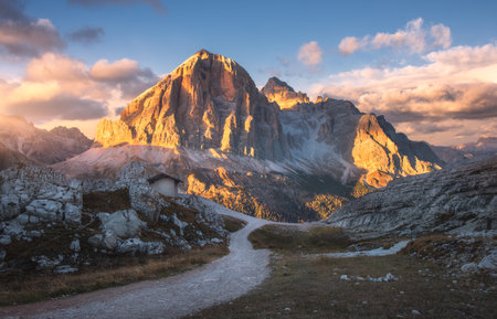 Mountains and sky with colorful clouds at sunset in autumnの写真素材