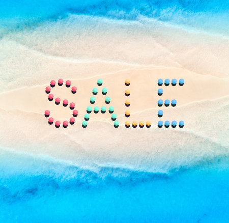 Creative text made from umbrellas on empty sandy beach, blue seaの写真素材