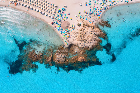 Aerial view of beautiful beach with white sand, umbrellas, seaの写真素材