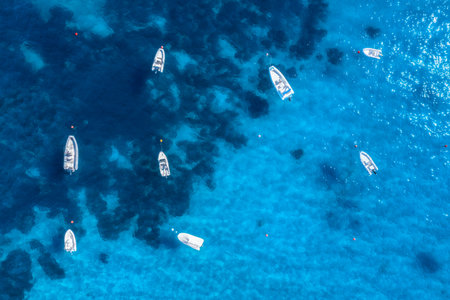Seascape with motorboats. Aerial view of blue sea and boatsの写真素材