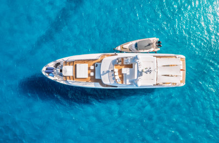 Aerial view of luxury yacht and boat in blue sea in summerの写真素材
