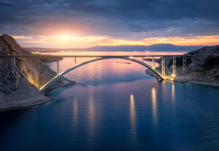 Bridge over the sea at sunset. Aerial view of modern Krk bridgeの写真素材