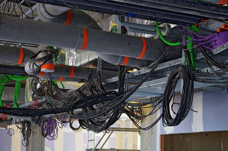 Besançon, France - July 17, 2014: Pipings and electrical wirings on a construction site.のeditorial素材