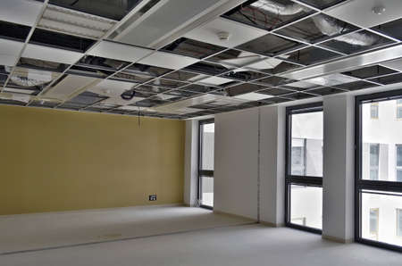 Besançon, France - June 4, 2015: Suspended ceiling not finished in a empty room of a construction site.のeditorial素材