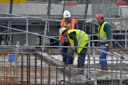 Besançon, France - January 15, 2014: Workmen on a construction site.のeditorial素材