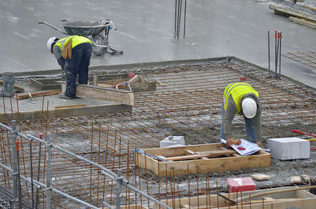 Besançon, France - January 15, 2014: Workmen on a construction site.のeditorial素材