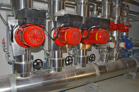 Besançon, France - May 11, 2015: Air conditioning ducts and electric water pumps on a construction site.のeditorial素材