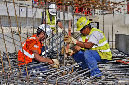 Besançon, France - July 23, 2013: Workmen on a construction site.のeditorial素材