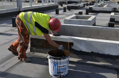 Besançon, France - March 18, 2014: Waterproofness work on a construction site.のeditorial素材