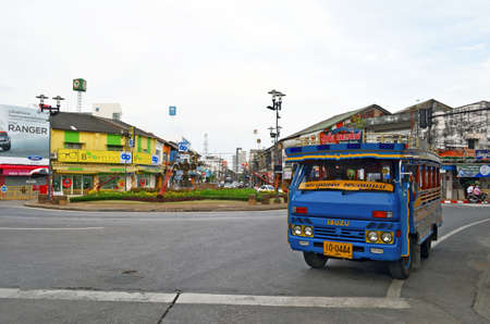 Phuket Town, Thailand - October 16, 2014: Songthaew turning from Bangkok Road to Ranong Road at Suriyadej Traffic Circle.のeditorial素材