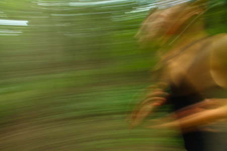 running women in a green parcの写真素材
