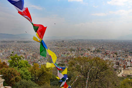 View of Katmandu Nepal from a temple with prayer flags