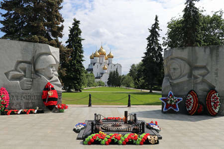 Eternal flame in Yaroslavl Russia with mary-sleeping cathedral in the backgroundの写真素材