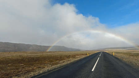 Rainbow across the road in Iceland