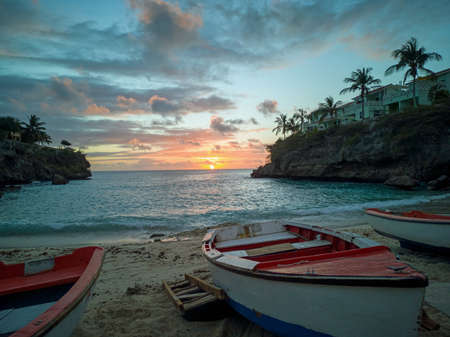 Blue Lagun beach on Curacao at sunset Fisher Boatの写真素材