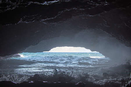 Cave with a view of the sea on Curacao natureの写真素材