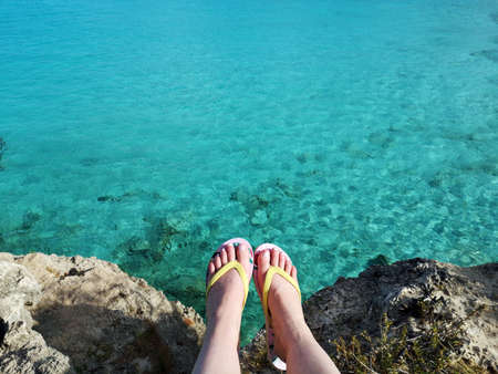Flip flops and sea on Curacao travel