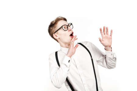 young man in glasses surprises and shock on white background