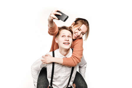 teenagers couple making selfie by smartphoneの写真素材