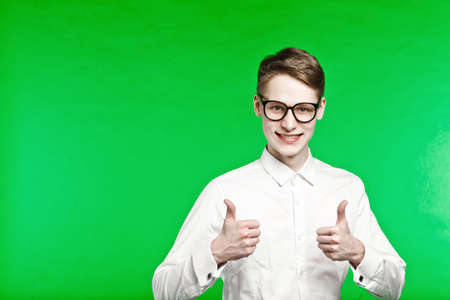 young man in glasses surprises and shockの写真素材