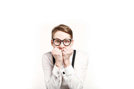young man in glasses surprises and shock on white background
