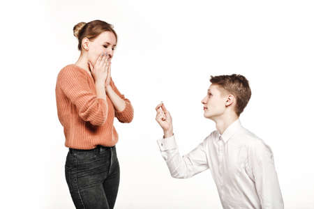 young man give ring to his girl engagementの写真素材