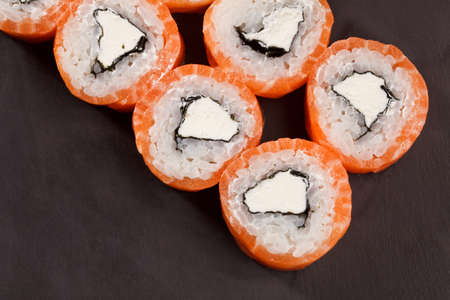 tasty Roll Philadelphia Sushi on black backround fishの写真素材
