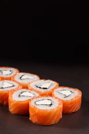 tasty Roll Philadelphia Sushi on black backround fish